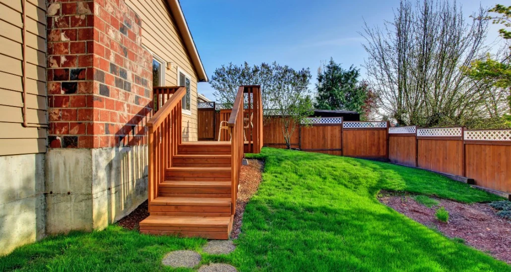 How Does a Fence Contractor Evaluate Property Slope Before Planning a Fence Installation?